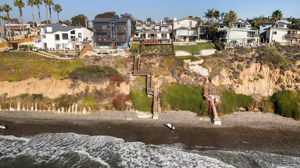 Aerial — Surfers Below the Bluff