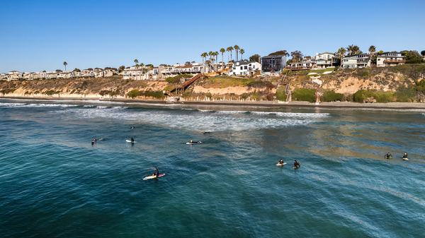 Surfers in Front of the House